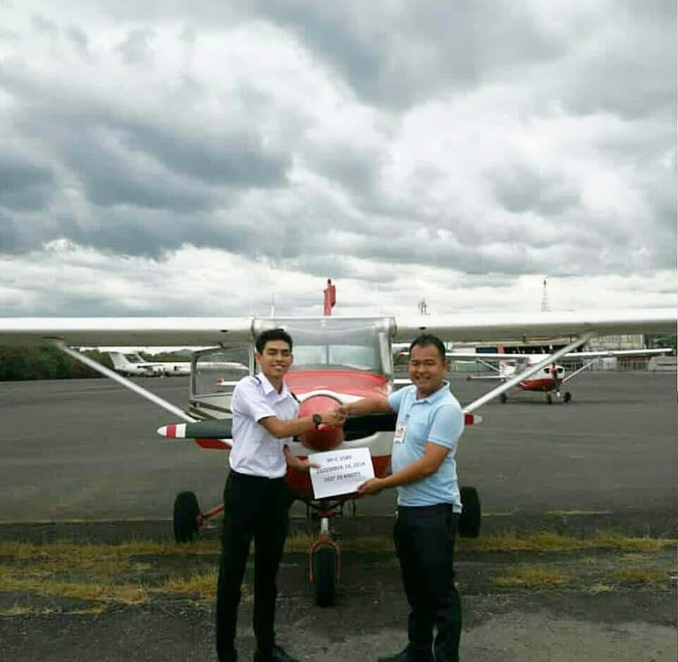 Student pilot handshake after first solo flight